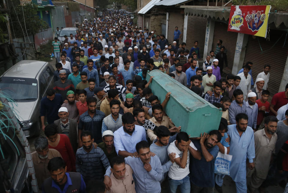 Villagers carry the body of slain policeman Adil Ahmad during his funeral at Zaura village, about 62 kilometers south of Srinagar, Indian controlled Kashmir, Wednesday, Aug. 29, 2018. Rebels fighting against Indian rule ambushed a group of police officers and killed four of them, including Ahmad, on Wednesday in the disputed Himalayan region of Kashmir, police said. (AP Photo/Mukhtar Khan)