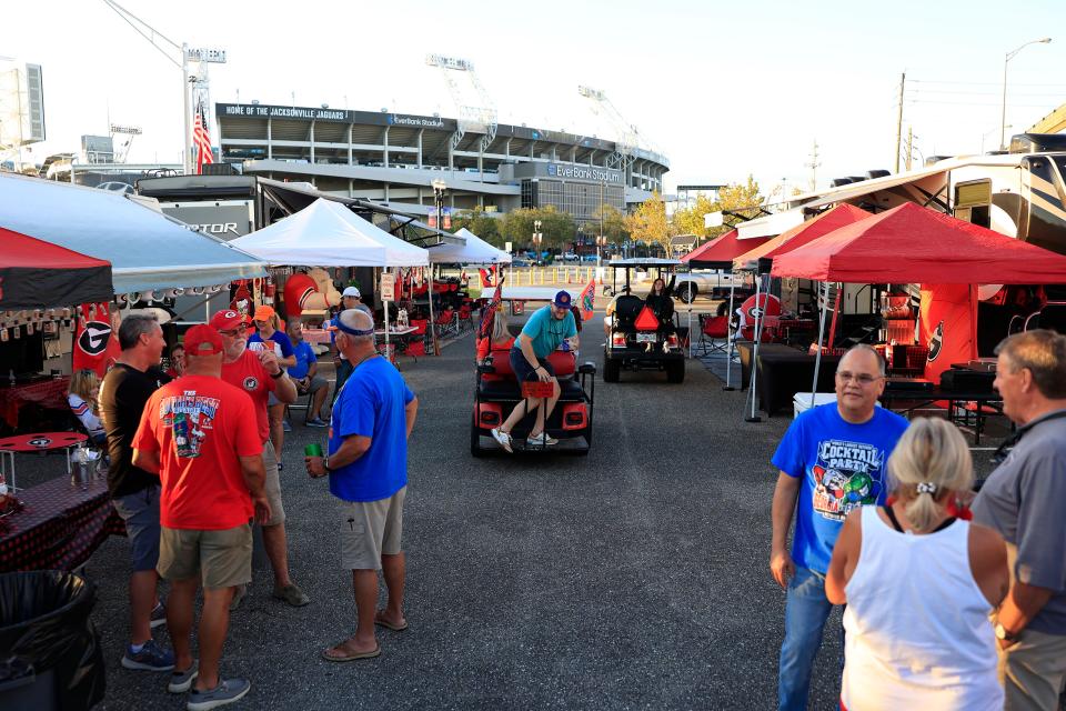 Fans gathered in a parking lot outside EverBank Stadium for festivities this week leading up to the annual Florida-Georgia college football game Saturday.