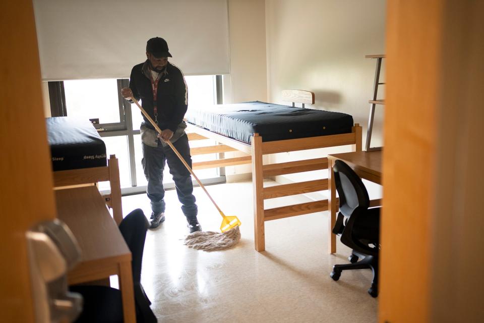 Eric Craft, who has been on Ohio State's operations crew for 27 years, cleans dorm rooms at Busch House.