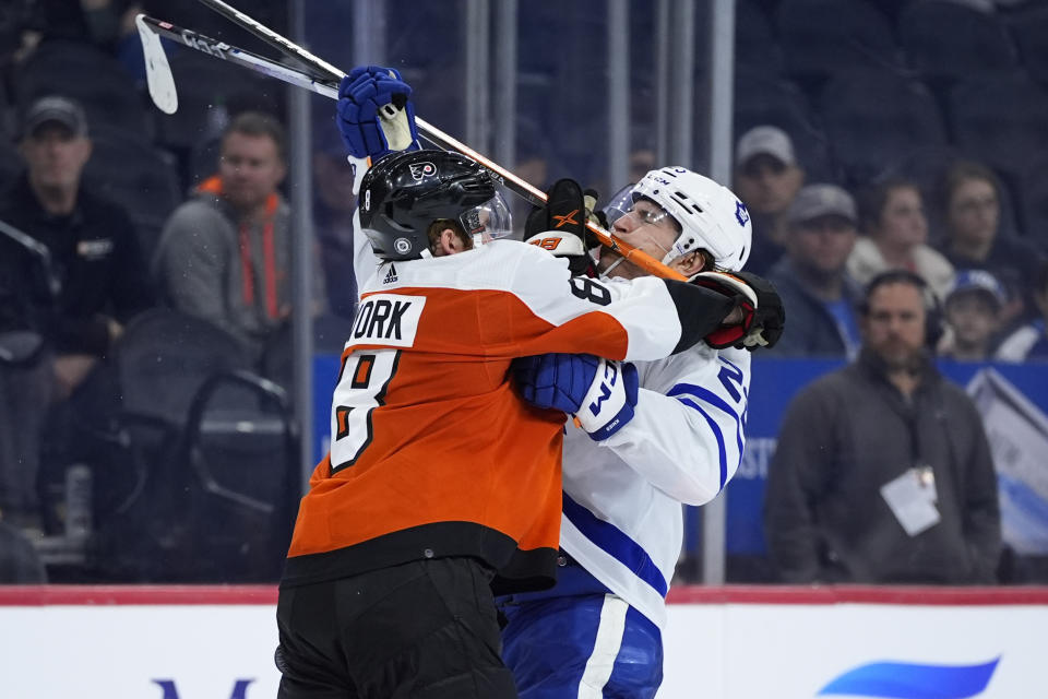 Philadelphia Flyers' Cam York, left, collides with Toronto Maple Leafs' Matthew Knies during the third period of an NHL hockey game, Thursday, March 14, 2024, in Philadelphia. (AP Photo/Matt Slocum)