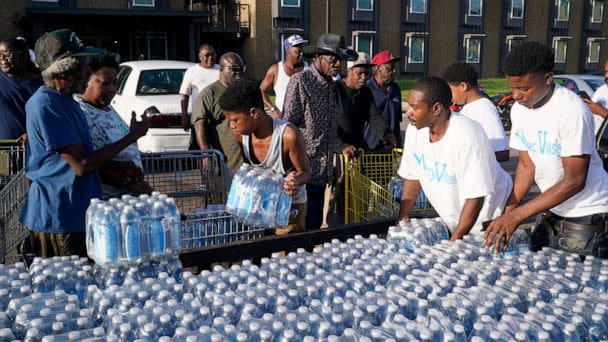 PHOTO: Water is being delivered to esidents of the Golden Keys Senior Living apartments  in Jackson, Miss., Sept. 1, 2022.   (Steve Helber/AP)