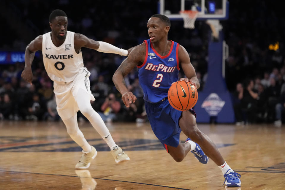 DePaul's Umoja Gibson (2) drives past Xavier's Souley Boum (0) in the second half of an NCAA college basketball game during the quarterfinals of the Big East conference tournament, Thursday, March 9, 2023, in New York. (AP Photo/John Minchillo)