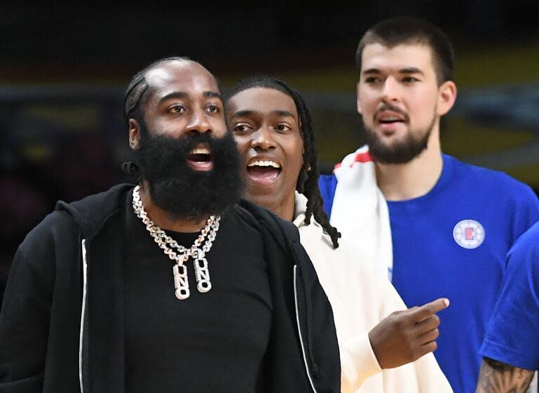 Los Angeles, California November 1, 2023- Newly acquired Clippers player James Harden wears street clothes on the bench during a game against the Lakers at Crypto.com Wednesday. (Wally Skalij/Los Angeles Times)