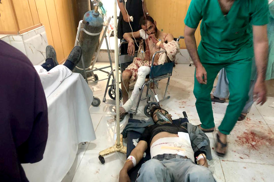 Injured men receive treatment at a hospital after a suicide attack in Zabul, Afghanistan, Thursday, Sept. 19, 2019. A powerful early morning suicide truck bomb devastated a hospital in southern Afghanistan on Thursday. (AP Photo/Ahmad Wali Sarhadi)