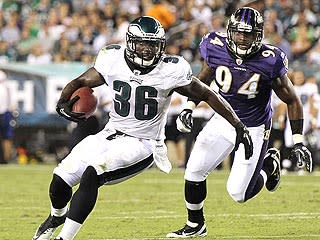 Sergio Kindle gives chase to Eagles running back Ronnie Brown in the Ravens' exhibition opener on Aug. 11