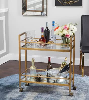 A gorgeous gold-toned bar cart for 30% off