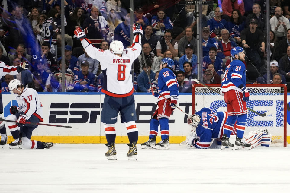 Washington Capitals' Alex Ovechkin (8) celebrates a goal by Dylan Strome (17) as New York Rangers goaltender Igor Shesterkin (31), Barclay Goodrow (21) and Ryan Lindgren (55) react during the second period in Game 2 of an NHL hockey Stanley Cup first-round playoff series, Tuesday, April 23, 2024, in New York. (AP Photo/Frank Franklin II)