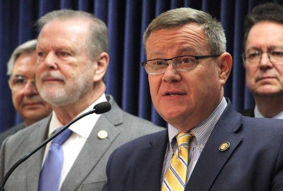 North Carolina House Speaker Tim Moore, center, speaks at a news conference about a Medicaid expansion agreement, Thursday, March 2, 2023, at the Legislative Building in Raleigh.