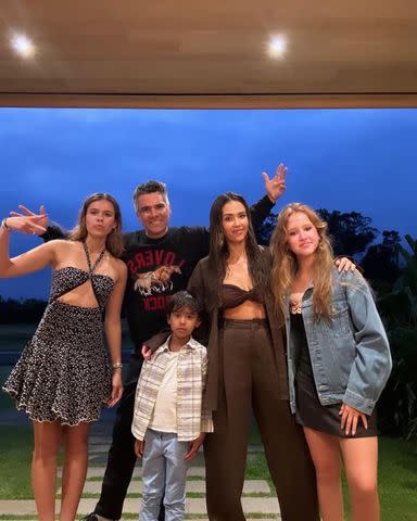 <p>Jessica Alba/Instagram</p> Jessica Alba and Cash Warren pose with their three kids