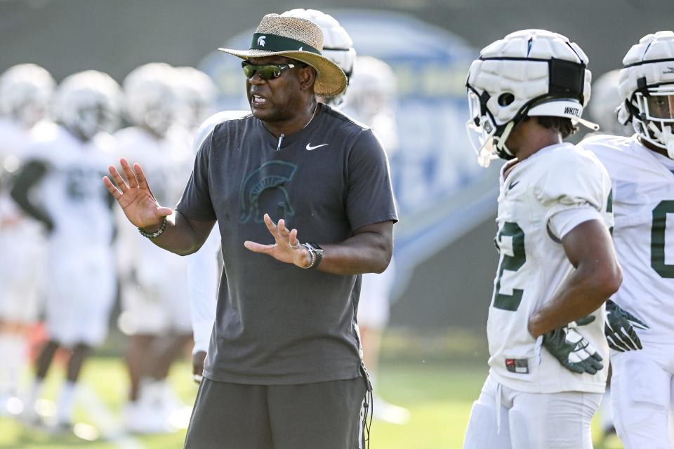 Michigan State's head coach Mel Tucker talks with the defensive backs during football camp on Tuesday, Aug. 17, 2021, on the MSU campus in East Lansing.