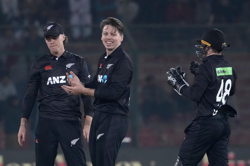 New Zealand's Michael Bracewell, center, celebrates with teammate after the dismissal of Pakistan's Fakhar Zaman during the first one-day international cricket match between Pakistan and New Zealand, in Karachi, Pakistan, Monday, Jan. 9, 2023. (AP Photo/Fareed Khan)