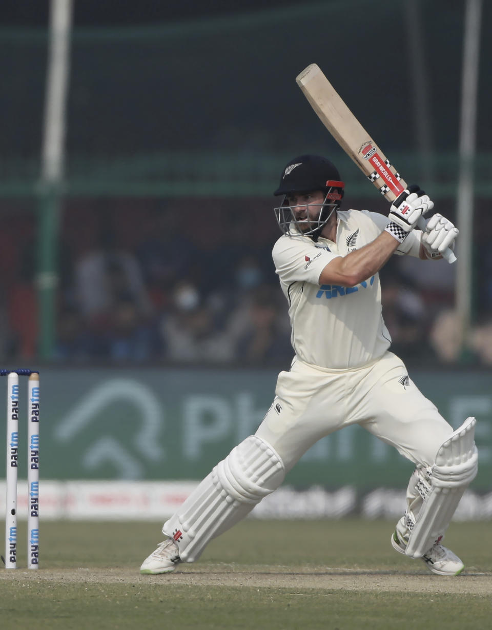 New Zealand's captain Kane Williamson plays a shot during the day three of their first test cricket match with India in Kanpur, India, Saturday, Nov. 27, 2021. (AP Photo/Altaf Qadri)