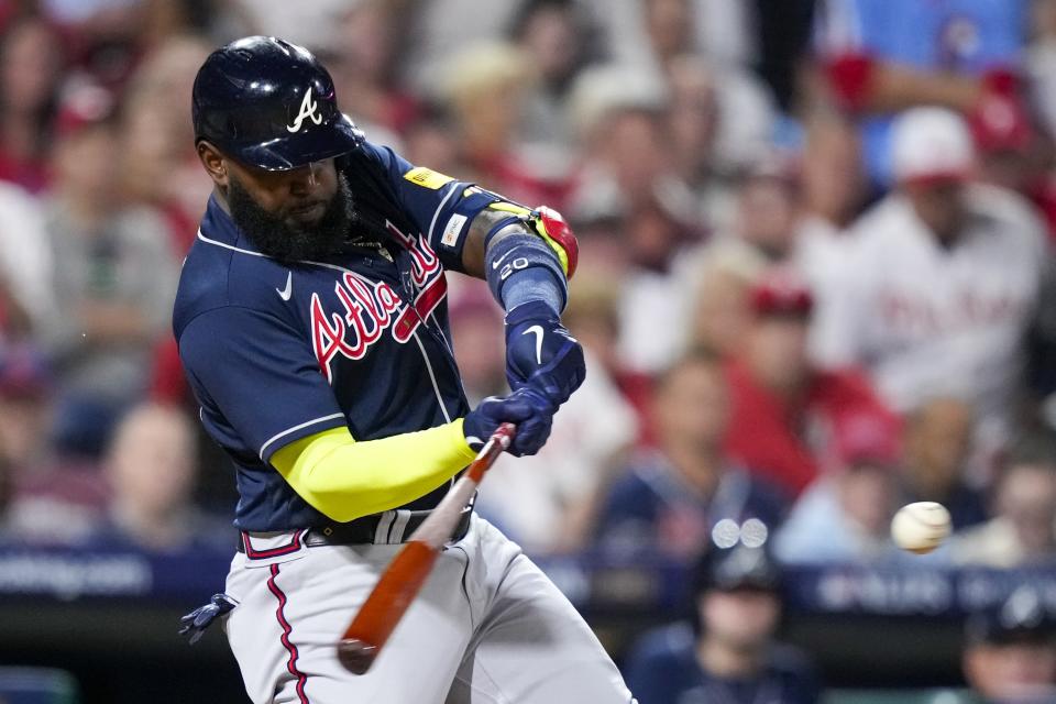 Atlanta Braves' Marcell Ozuna hitrs a single during the sixth inning of Game 3 of a baseball NL Division Series against the Philadelphia Phillies Wednesday, Oct. 11, 2023, in Philadelphia. (AP Photo/Matt Slocum)