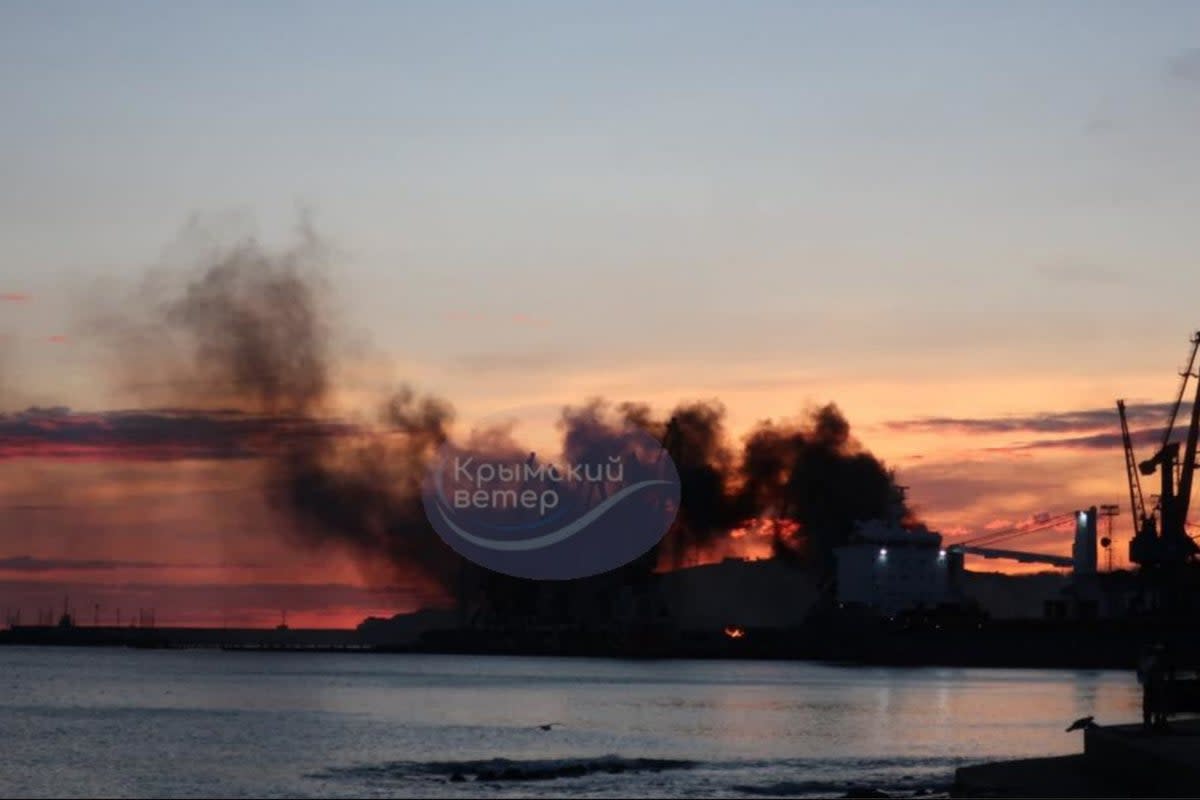 Smoke is seen rising above a damaged warship following a Ukrainian attack in the Russian-occupied Black Sea port (AFP)