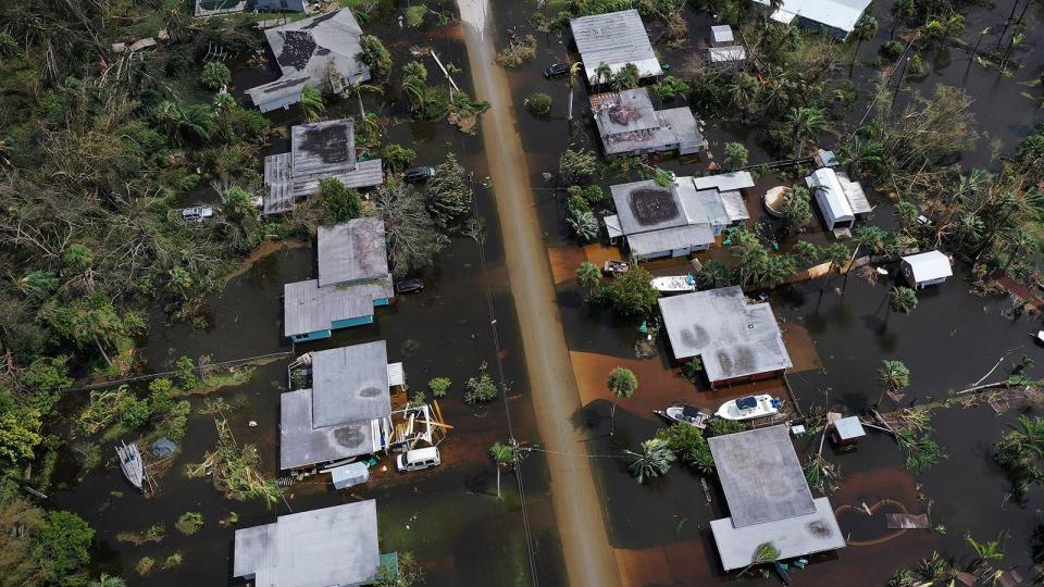 In this aerial view, flooded homes are shown after Hurricane Ian moved through the Gulf Coast of Florida on September 29, 2022 in Port Charlotte, Florida. The hurricane brought high winds, storm surges and rain to the area causing severe damage.