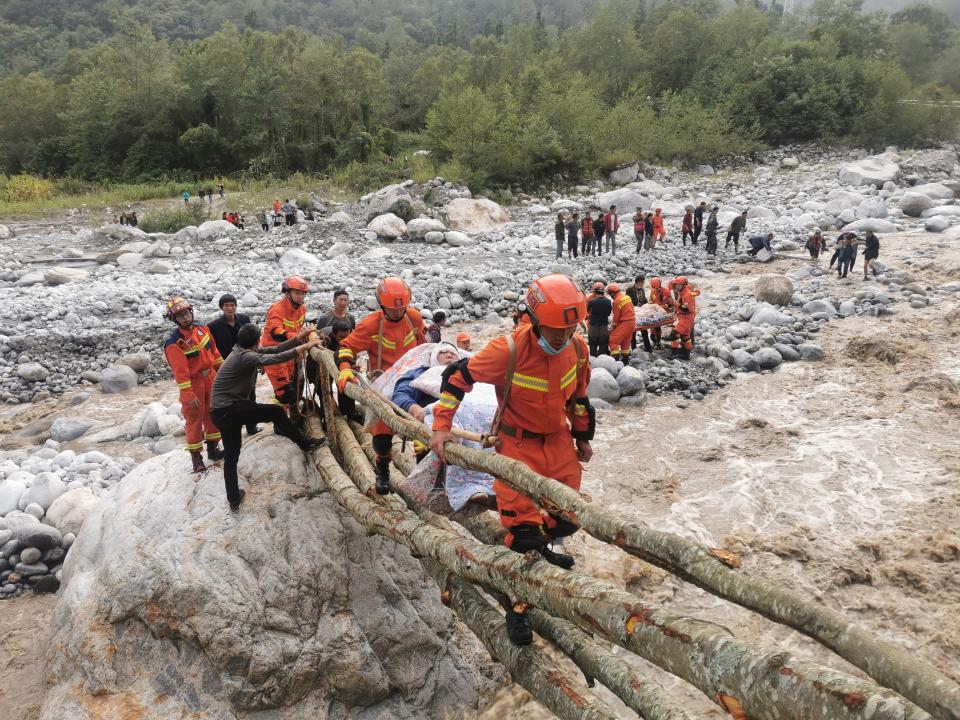 LUDING, CHINA - SEPTEMBER 05: Rescuers transfer injured and trapped residents from Mozigou village on September 5, 2022 in Luding County, Garze Tibetan Autonomous Prefecture, Sichuan Province of China. A 6.8-magnitude earthquake jolted Luding county in Southwest China's Sichuan province on Monday, killing at least 46 people. (Photo by VCG/VCG via Getty Images)