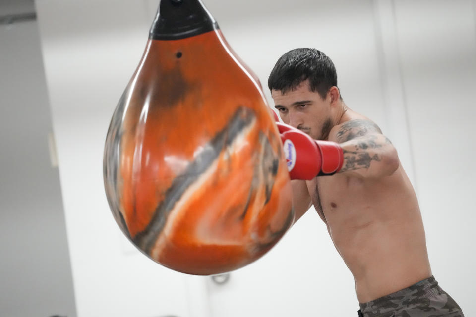 Biaggio Ali Walsh hits a punching bag while training ahead of his return to the Professional Fighters League, Monday, July 24, 2023, in New York. (AP Photo/Mary Altaffer)