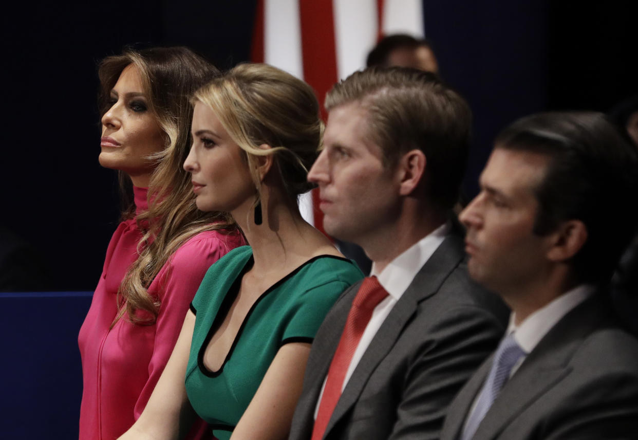 FILE - In this Sunday, Oct. 9, 2016 file photo, from left, Melania Trump, Ivanka Trump, Eric Trump and Donald Trump, Jr. wait for the second presidential debate between Republican presidential nominee Donald Trump and Democratic presidential nominee Hillary Clinton at Washington University in St. Louis. (AP Photo/John Locher)