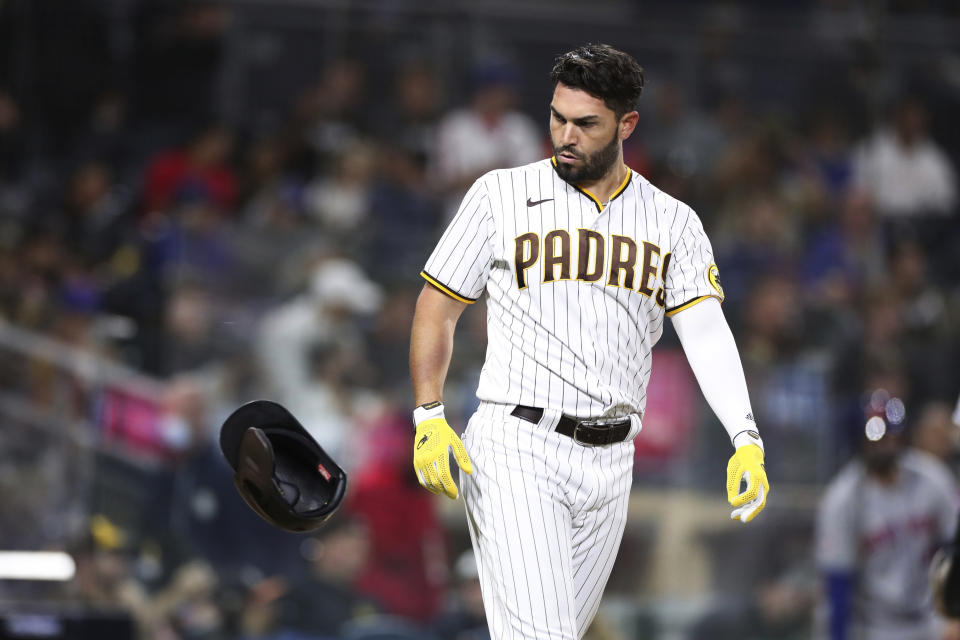 San Diego Padres' Eric Hosmer throws his helmet toward the dugout after striking out against New York Mets starting pitcher Jacob deGrom during the sixth inning of a baseball game Saturday, June 5, 2021, in San Diego. (AP Photo/Derrick Tuskan)