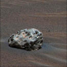 <p>In this image released Jan. 19, 2005, NASA’s Mars Exploration Rover “Opportunity” has found an iron meteorite on Mars, the first meteorite of any type ever identified on another planet. The pitted, basketball-size object is mostly made of iron and nickel. (Photo: NASA/JPL/Cornell/Reuters) </p>