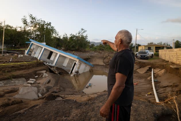 A man points to a home that was collapsed by Hurricane Fiona at Villa Esperanza in Salinas, Puerto Rico, Wednesday, September 21, 2022. (Photo: Alejandro Granadillo via Associated Press)