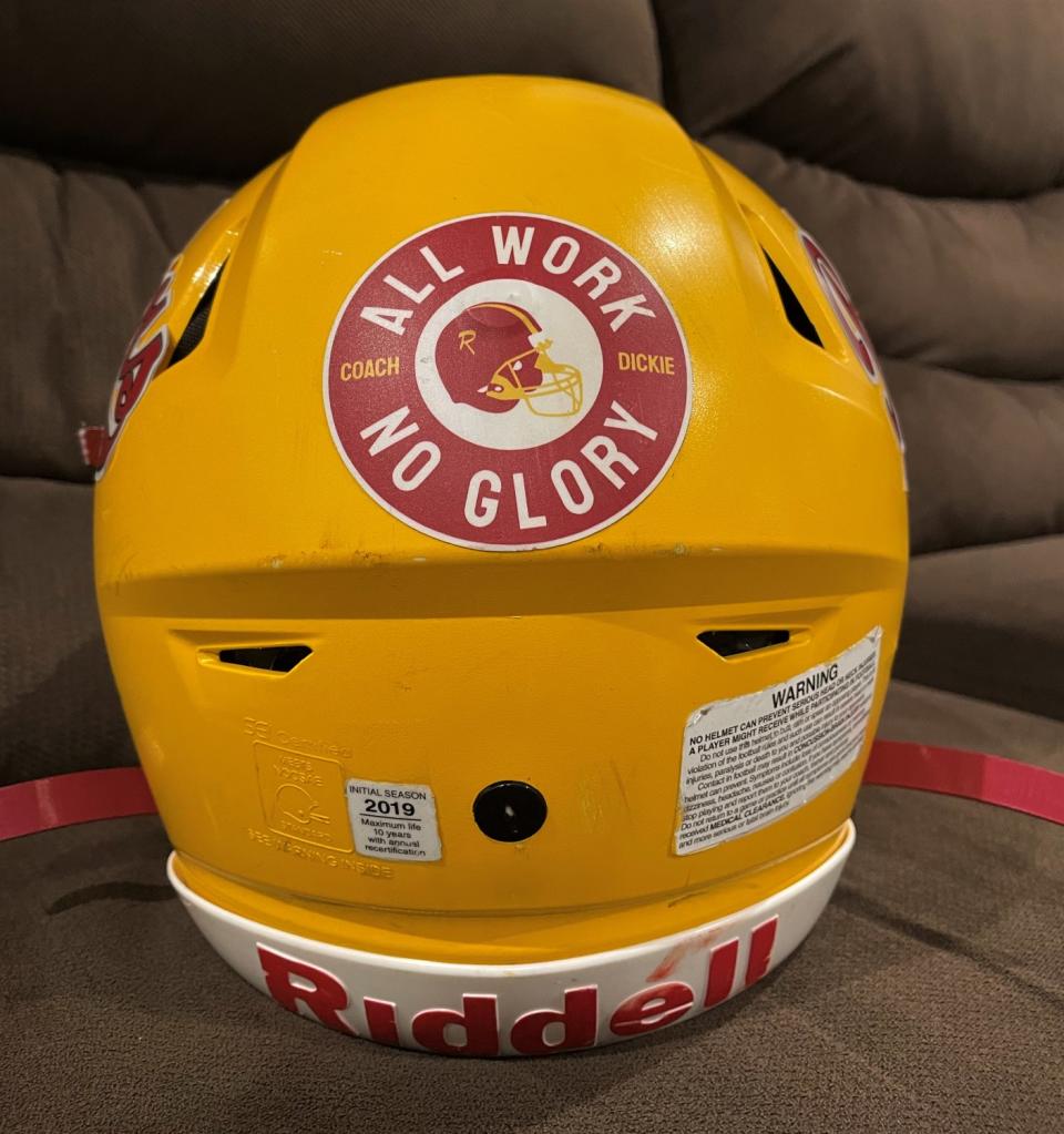 A Roosevelt High football helmet with former assistant coach Richard Guillen's motto.
