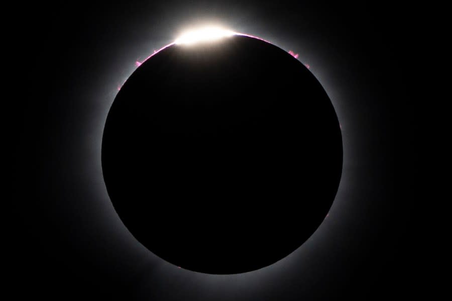 The moon nearly covers the sun during a total solar eclipse, as seen from Bishop’s University in Sherbrooke, Quebec, Monday, April 8, 2024. (AP Photo/Mark Schiefelbein)