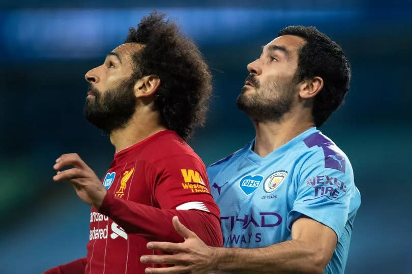 Mohamed Salah of Liverpool and Ilkay Gündogan of Manchester City in action during the Premier League match between Manchester City and Liverpool FC at Etihad Stadium on July 2, 2020 in Manchester, United Kingdom.