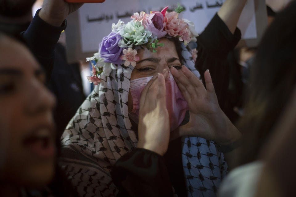 Palestinians chant slogans during a protest against the forcible eviction of Palestinians from their homes in the Sheikh Jarrah neighborhood of east Jerusalem, in the West Bank city of Ramallah, Sunday, May 9, 2021. (AP Photo/Majdi Mohammed)