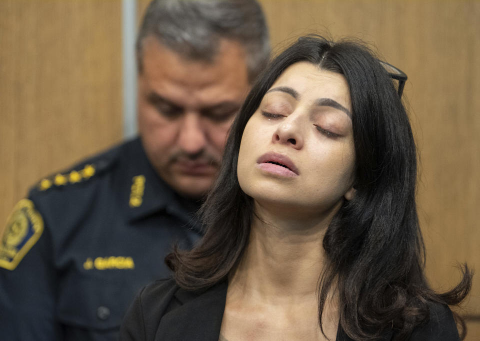 April Aguirre, aunt of Arlene Alvarez, 9, who died after being shot in February of this year, listens during a press conference, Tuesday, July 19, 2022, at Crime Stoppers in Houston. A grand jury has declined to indict a Houston man on charges related to the death of 9-year-old Arlene Alvarez, who was inadvertently shot by the man after he was robbed and fired his weapon into the Alvarez's car. Crime Stoppers has presser seeking information on the robber related to the shooting. (Mark Mulligan/Houston Chronicle via AP)