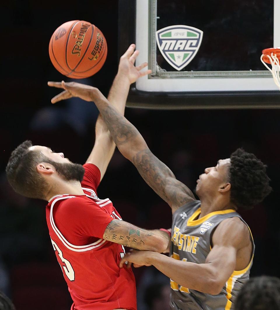 Kent State's Justyn Hamilton blocks the shot of Miami's Elijah McNamara in a Mid-American Conference Tournament quarterfinal game on Thursday in Cleveland, Ohio, at Rocket Mortgage FieldHouse.