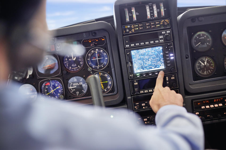 A stock image of a pilot in cockpit.