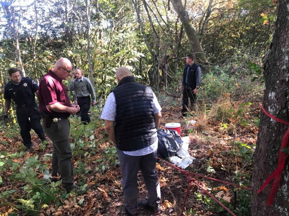 Police seen at the location the body was found in the bush.