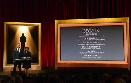 Actor Chris Hemsworth (L) and Academy of Motion Picture Arts and Sciences President Cheryl Boone Isaacs announce the nominees for Best Animated Feature at the 86th Academy Awards nominee announcements in Beverly Hills, California January 16, 2014. REUTERS/Phil McCarten