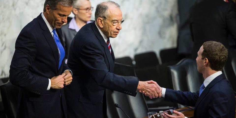 Facebook co-founder, Chairman and CEO Mark Zuckerberg shakes hands with U.S. Sen. Chuck Grassley (R-IA) after testifying before a combined Senate Judiciary and Commerce committee hearing in the Hart Senate Office Building on Capitol Hill April 10, 2018.