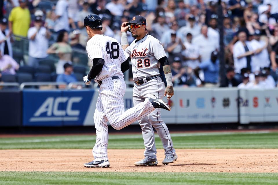 Yankees first baseman Anthony Rizzo (48) interacts with Tigers shortstop Javier Baez after hitting a home run against the Tigers during the sixth inning June 4, 2022, at Yankee Stadium. Baez and Rizzo won the 2016 World Series as members of the Chicago Cubs before being traded from the team in 2021.