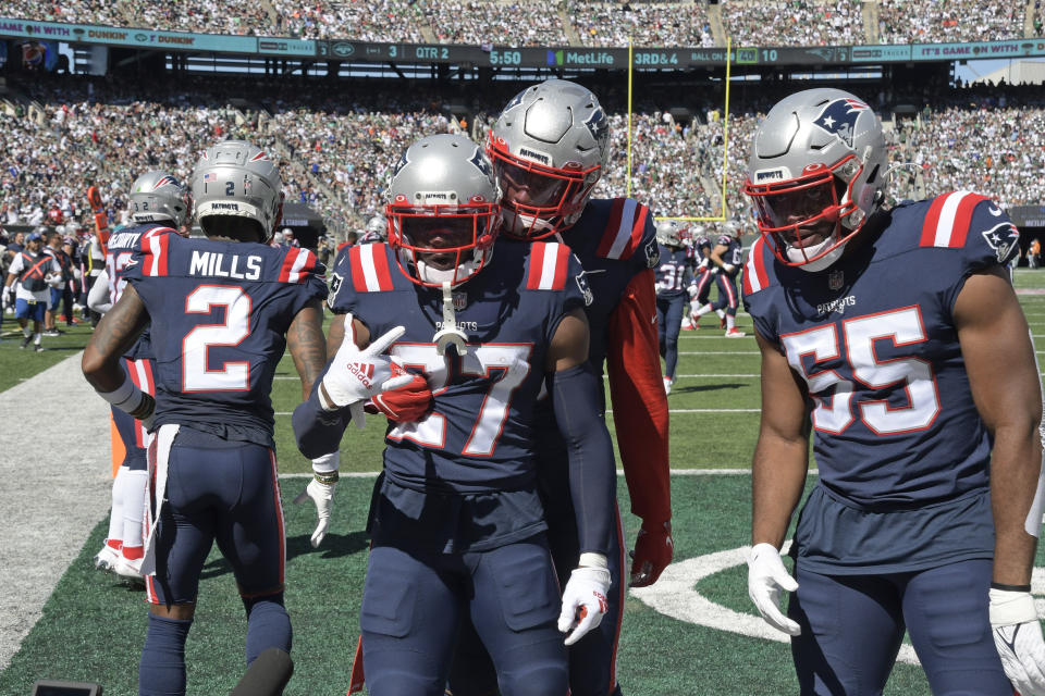 New England Patriots' J.C. Jackson (27) celebrates his interception during the first half of an NFL football game against the New York Jets, Sunday, Sept. 19, 2021, in East Rutherford, N.J. (AP Photo/Bill Kostroun)