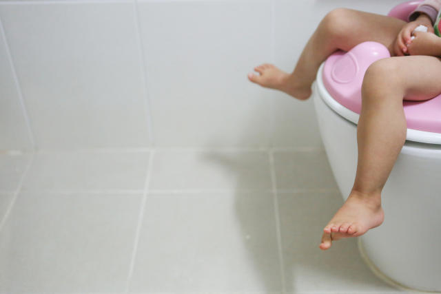 Toddler Girl On A Potty In The Living Room High-Res Stock Photo - Getty  Images