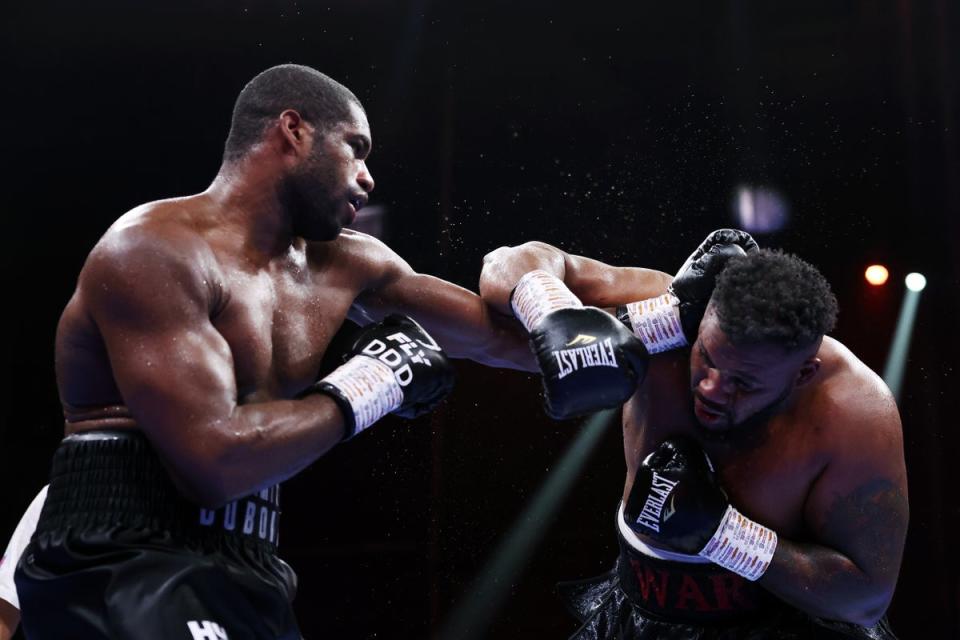 Dubois (left) stopped Jarrell Miller in the final seconds of their back-and-forth bout (Getty Images)