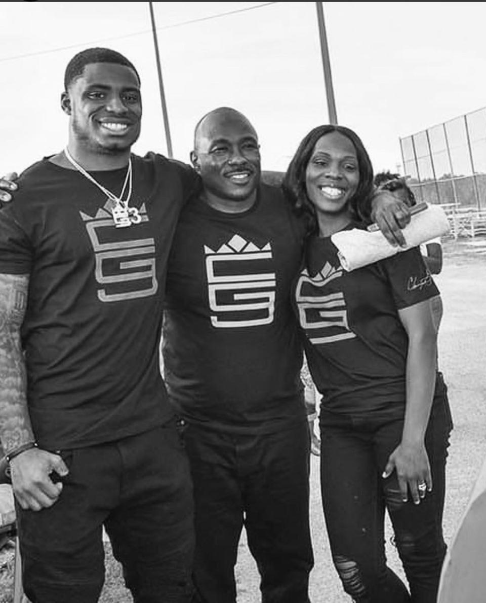 Lions defensive back C.J. Gardner-Johnson, left, with his father, Brian, and mother, Del.