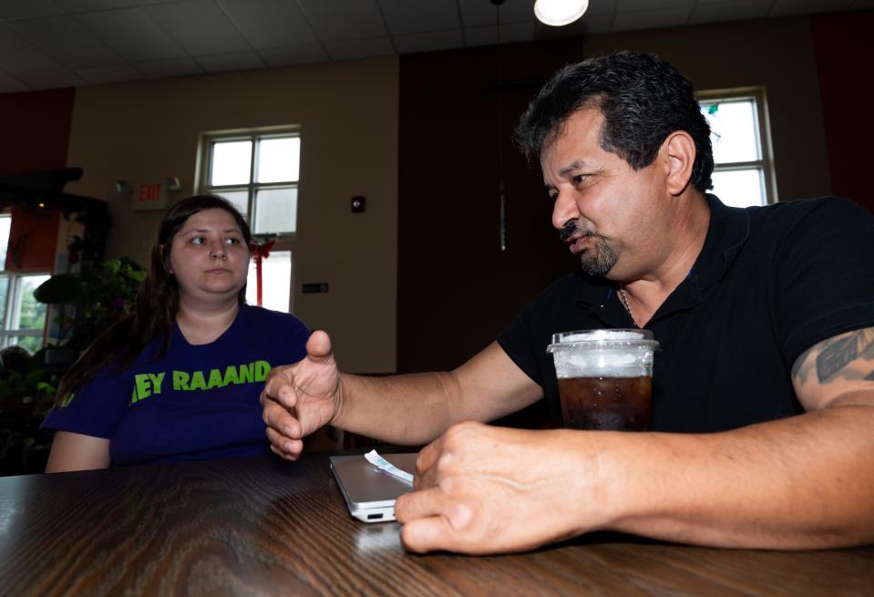 Lizeth Zorrilla-Sanchez, owner of La Finca Coffeehouse, and her father Juan Jose Zorrilla speak to one another on Tuesday July 16, 2024 in Milwaukee, Wis.