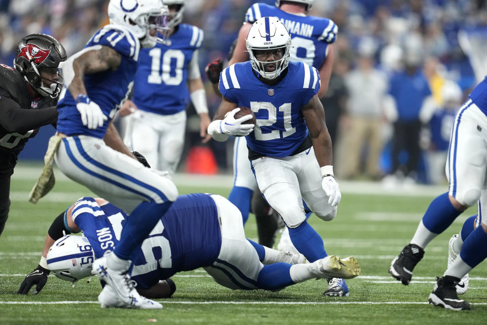 Indianapolis Colts running back Zack Moss (21) runs the ball during the second half of an NFL football game against the Tampa Bay Buccaneers Sunday, Nov. 26, 2023, in Indianapolis. (AP Photo/Michael Conroy)