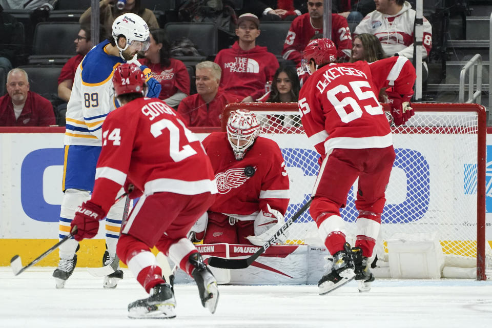 Detroit Red Wings goaltender Alex Nedeljkovic (39) stops a Buffalo Sabres right wing Alex Tuch (89) shot in the second period of an NHL hockey game Saturday, Jan. 15, 2022, in Detroit. (AP Photo/Paul Sancya)