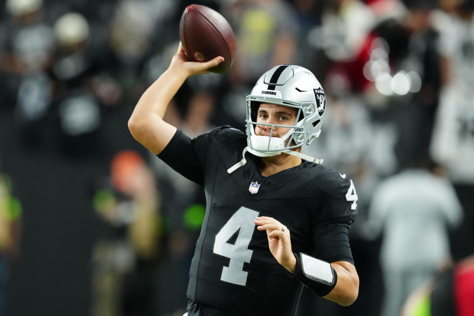 Dec 14, 2023; Paradise, Nevada, USA; Las Vegas Raiders quarterback Aidan O’Connell (4) warms up before the game against the <a class="link " href="https://sports.yahoo.com/nfl/teams/la-chargers/" data-i13n="sec:content-canvas;subsec:anchor_text;elm:context_link" data-ylk="slk:Los Angeles Chargers;sec:content-canvas;subsec:anchor_text;elm:context_link;itc:0">Los Angeles Chargers</a> at Allegiant Stadium. Mandatory Credit: Stephen R. Sylvanie-USA TODAY Sports