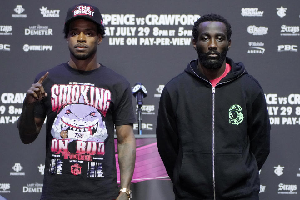 Errol Spence Jr., left, and Terence Crawford pose during a news conference Thursday, July 27, 2023, in Las Vegas. The two are scheduled to fight in an undisputed welterweight championship boxing match Saturday in Las Vegas. (AP Photo/John Locher)