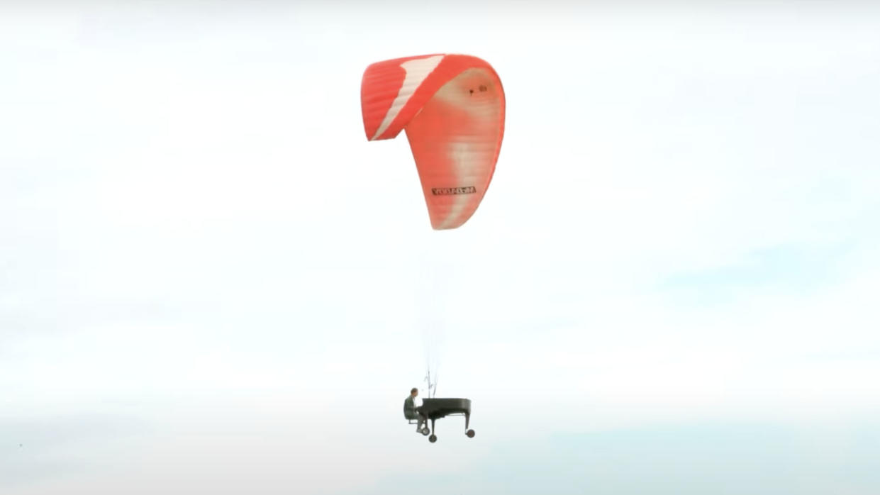  A flying piano, in the air. 