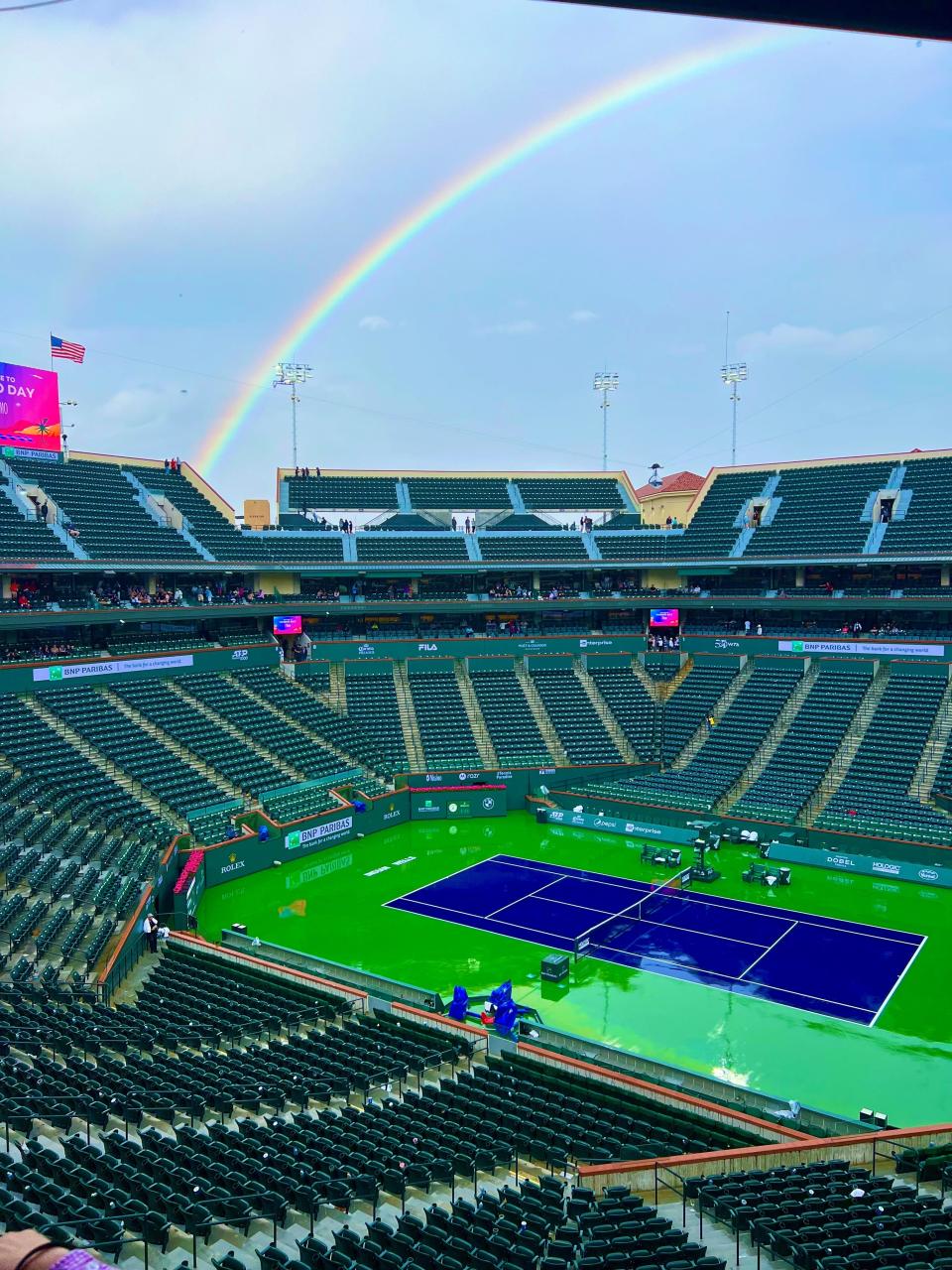 A rainbow aches over Stadium 1 at the Indian Wells Tennis Garden on Friday, March 10, 2023. Play was stopped for more than an hour, delaying the Shelby Rogers versus Maria Sakkari match at the 2023 BNP Paribas Open.