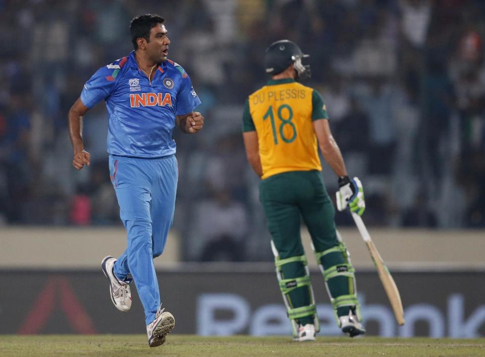 India's bowler Ravichandran Ashwin, left, celebrates the dismissal of South Africa's batsman Hashim Amla during their ICC Twenty20 Cricket World Cup semi-final match in Dhaka, Bangladesh, Friday, April 4, 2014. (AP Photo/Aijaz Rahi)