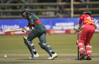 Bangladesh batsman Mushfiqur Rahim plays a shot on the final day of the One-Day International cricket match between Zimbabwe and Bangladesh at Harare Sports Club in Harare, Zimbabwe, Wednesday, Aug, 10, 2022. (AP Photo/Tsvangirayi Mukwazhi)