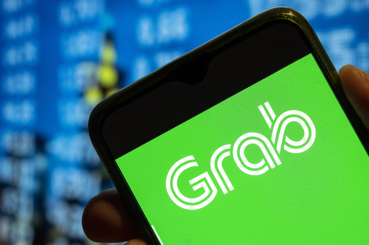 A photo of Grab's logo on a phone.